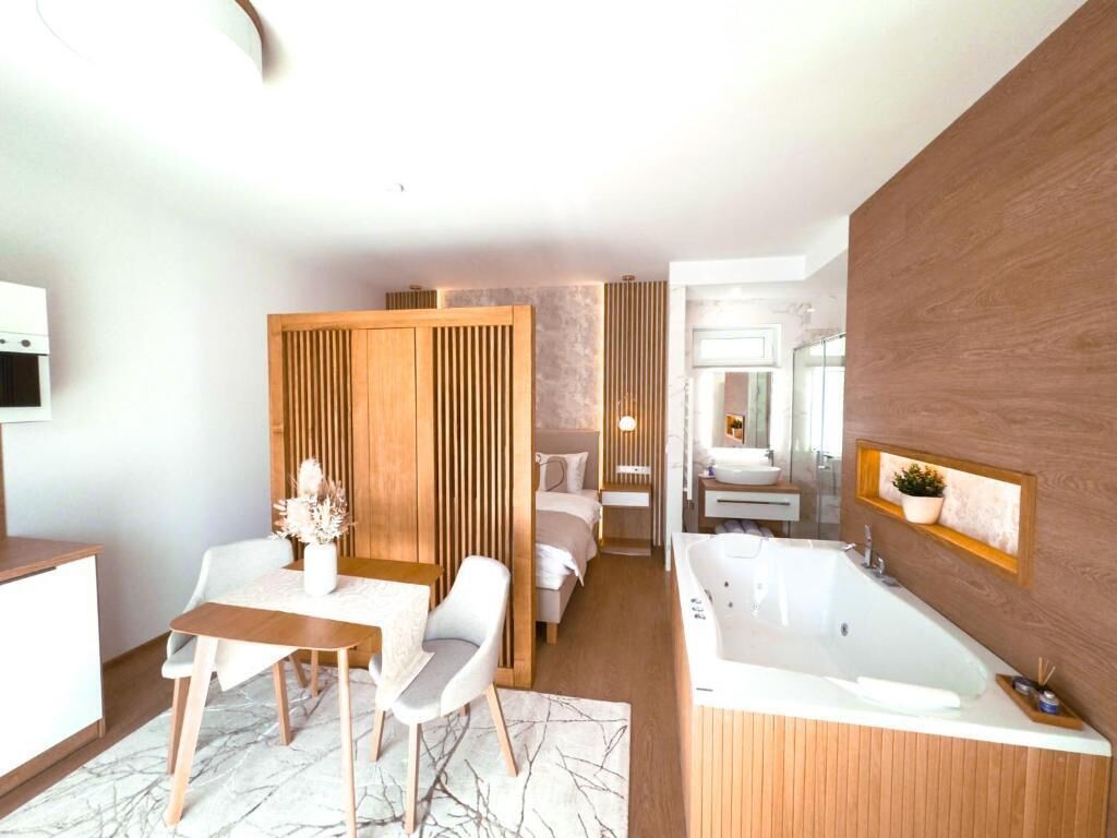Deluxe Apartment, Balcony, Courtyard View | In-room safe, soundproofing, iron/ironing board, free WiFi