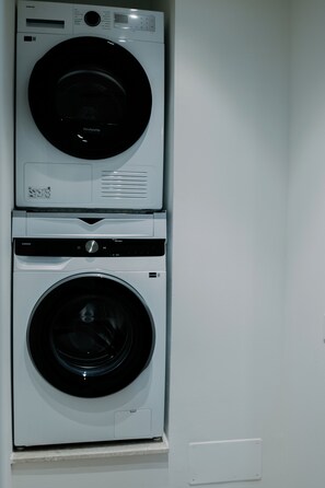 A wall-mounted washer and dryer unit with a control panel and a digital display. - NAUSICAA: Your Sardinia vacation begins in Cagliari (Cagliari)