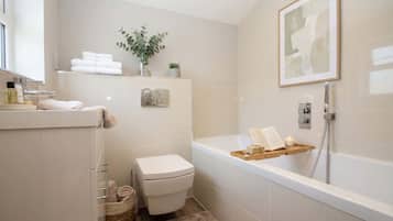 Shower, hair dryer, towels, shampoo