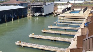 A water treatment facility with multiple wooden platforms and a covered area.