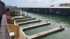 A marina with wooden docks and boats.