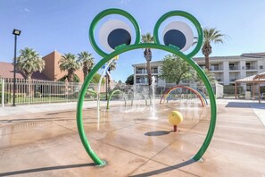 A water play area with a frog-shaped structure, a yellow ball, and a rainbow arch. - Newly updated cozy 2-bedroom condo with spacious balcony (St. George)