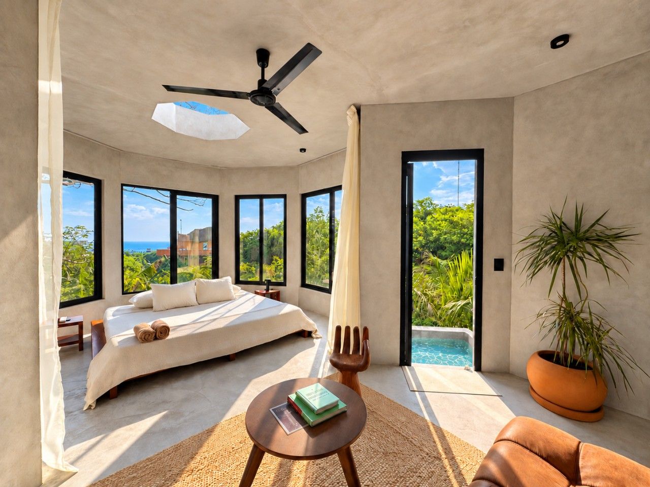 Un dormitorio moderno con una cama grande, un ventilador de techo y vistas a una piscina.