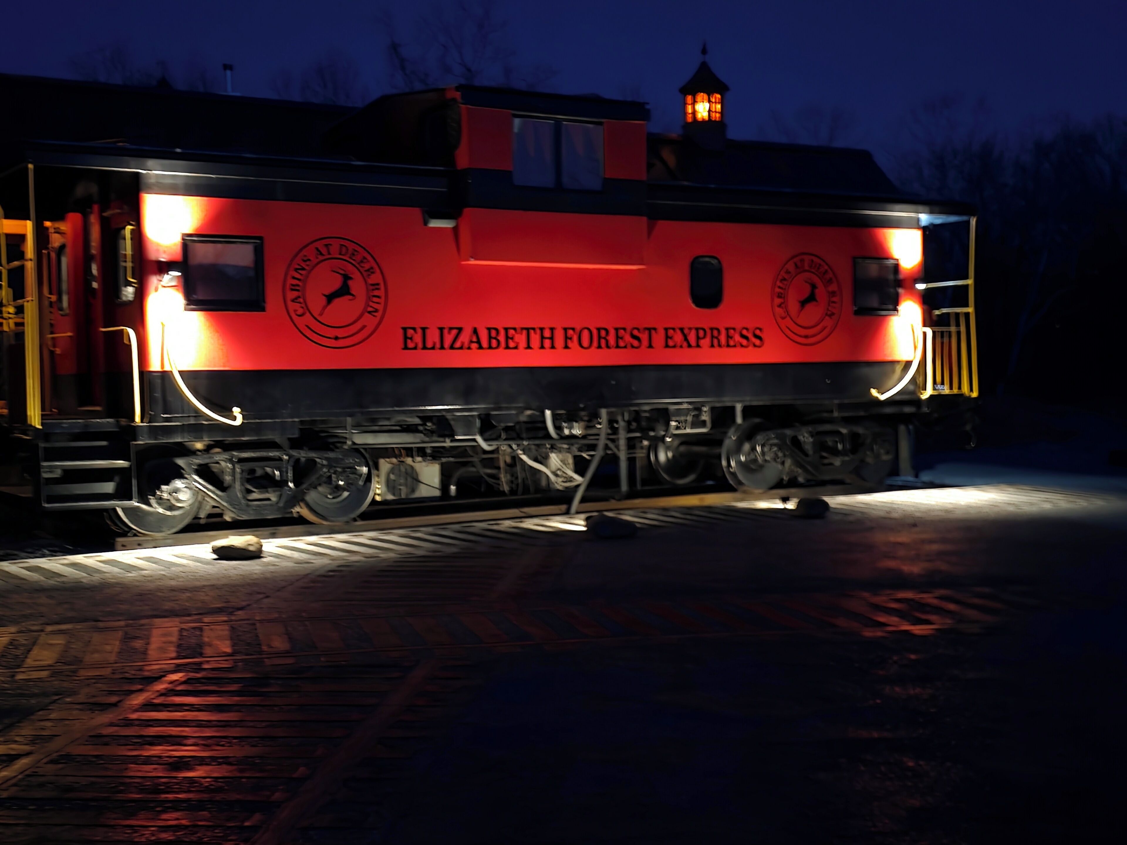A train with 'ELIZABETH FOREST EXPRESS' written on its side.