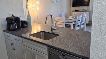 Coffee/tea maker, fridge, microwave, oven