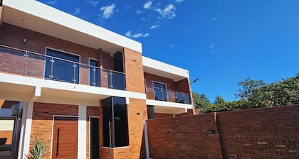 House near the airport, with large terraces and a barbecue