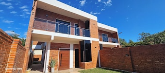 House near the airport, with large terraces and a barbecue