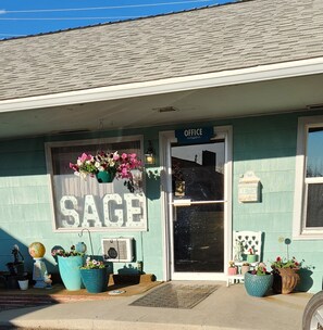 A building with a sign reading 'SAGE OFFICE' and a door labeled 'OFFICE'.