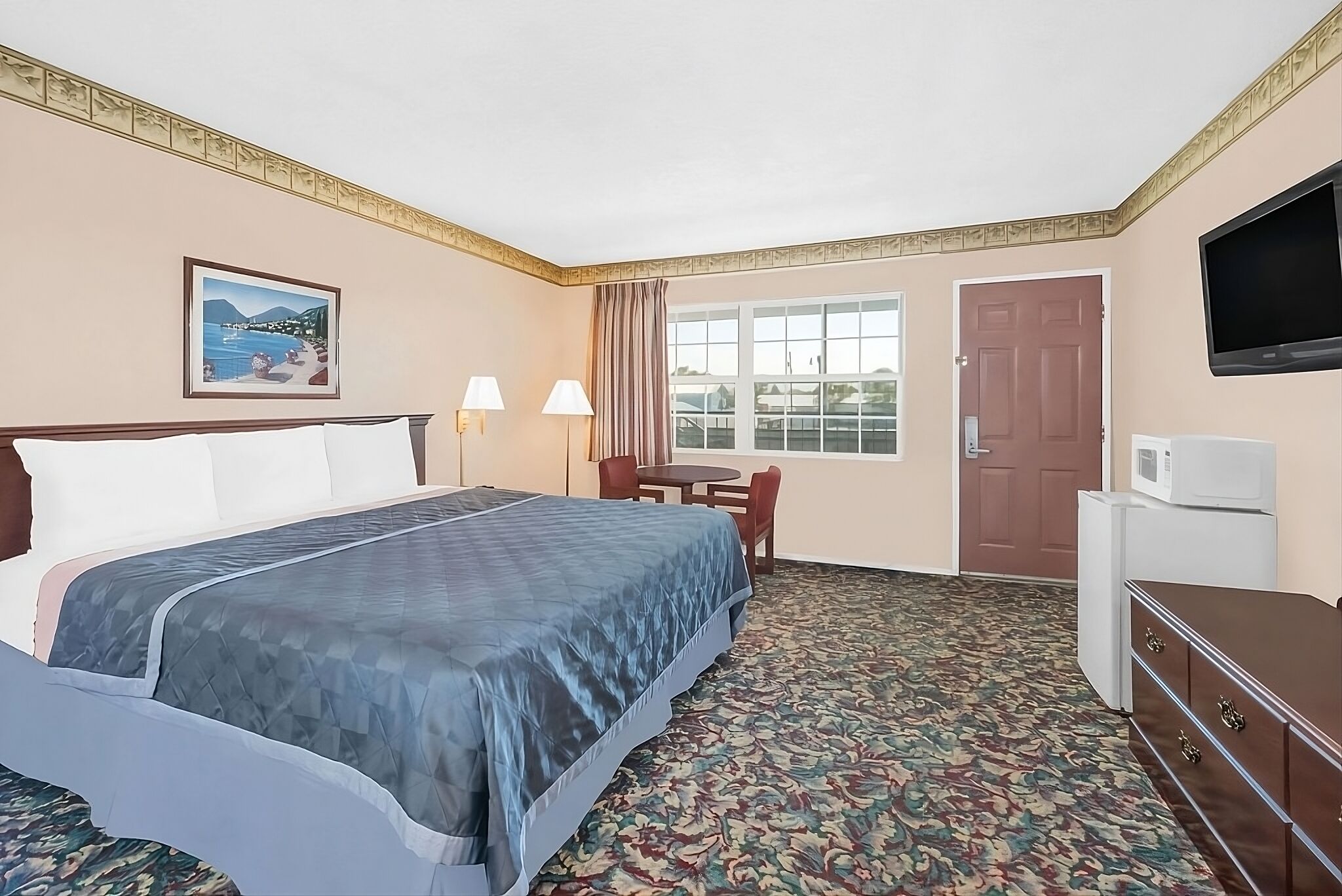 Relax in a bright room with TV and easy entry access.