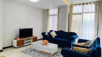 Căn hộ Deluxe, ban công, quang cảnh thành phố | Khu phòng khách
