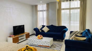Apartamento Deluxe, balcón, vistas a la ciudad | Zona de estar
