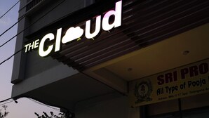 A hotel named 'The Cloud' with a reception area, a balcony, and a sign for 'Sri Proja All Type of Pooja'.