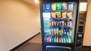 A vending machine with snacks and beverages.