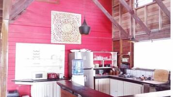 Full-sized fridge, microwave, stovetop, cookware/dishes/utensils