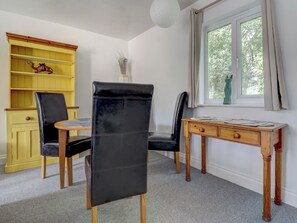 A room with a desk, two chairs, a bookshelf, and a window with a view. - 2 bedroom accommodation in Ryde (Ryde)