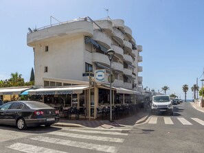 A multi-story building with a restaurant named 'Aquario' on the ground floor. - Marinada Cambrils by Interhome (Cambrils)