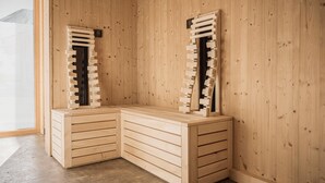 A corner room with wooden walls, a built-in bench with drawers, and a window with a view of a mountain. - Chalet With Mountain Views, Dein Bichlbach (Bichlbach)