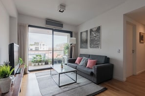 Departamento de lujo, vista a la ciudad | Área de sala de estar
