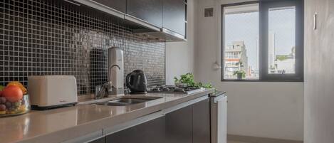 Apartamento, vista para a cidade | Cozinha privada