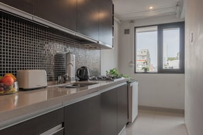 Departamento de lujo, vista a la ciudad | Cocina privada