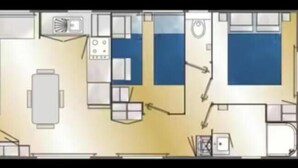 A hotel room layout with a bed, a desk, a chair, a small table, a bathroom, and a kitchenette. - Mobile Home, at a Campground ⭐️⭐️⭐️⭐️⭐️ 3 km from the ocean (Saint-Arnoult)