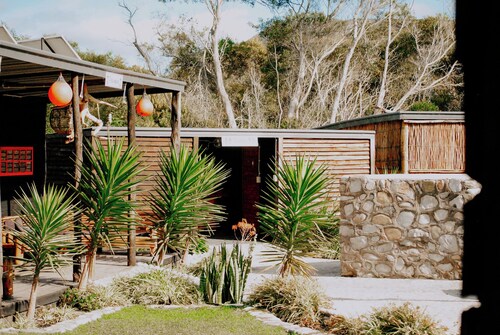 Flow @ Tides Glamping is a secluded glamping retreat surrounded by trees.