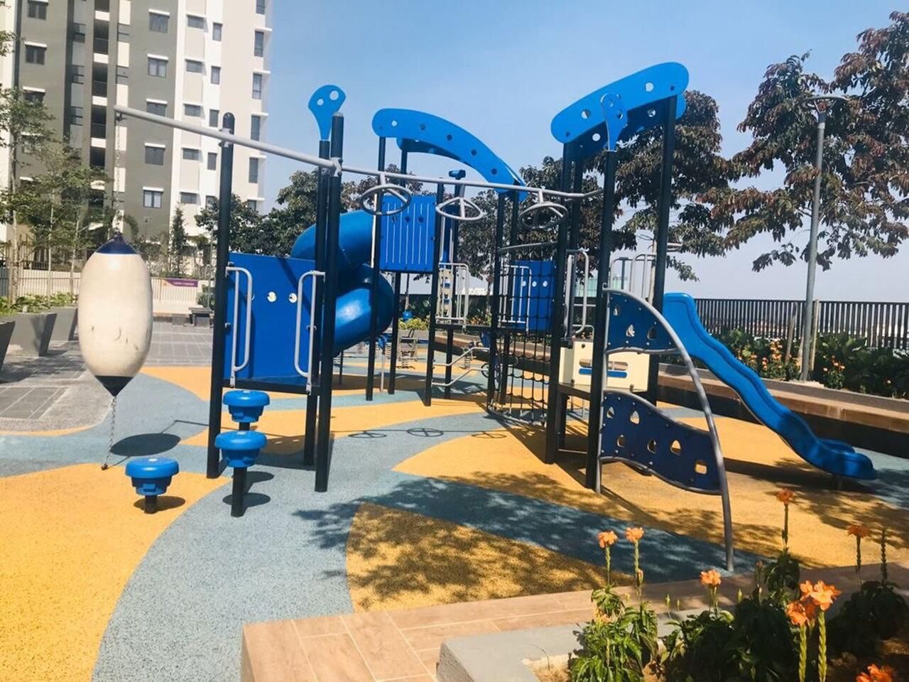 A playground with climbing structures and slides.