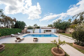 A backyard with a swimming pool, lounge chairs, and a small house. - LXR Villa Mirador del Sur, 5 Bedrooms, Ocean Views (Marbella)