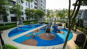 A playground with exercise equipment, surrounded by trees and a building. - Equine Residence - Seri Kembangan (Seri Kembangan)