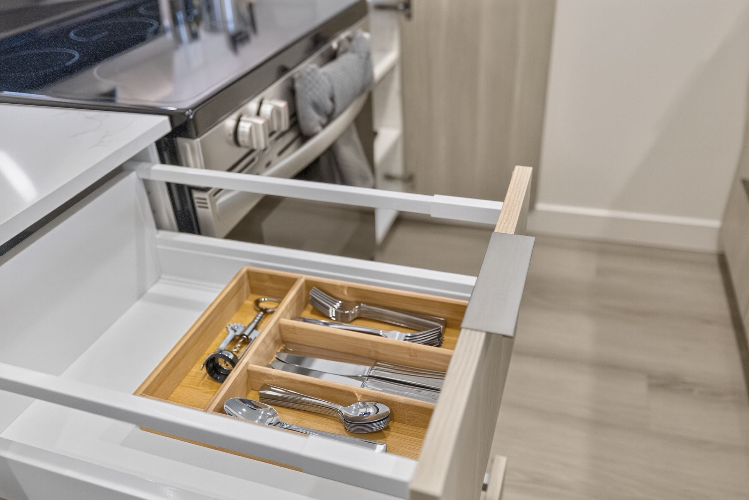 A kitchen drawer with utensils neatly organized.