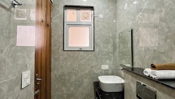Shower, towels, soap, toilet paper