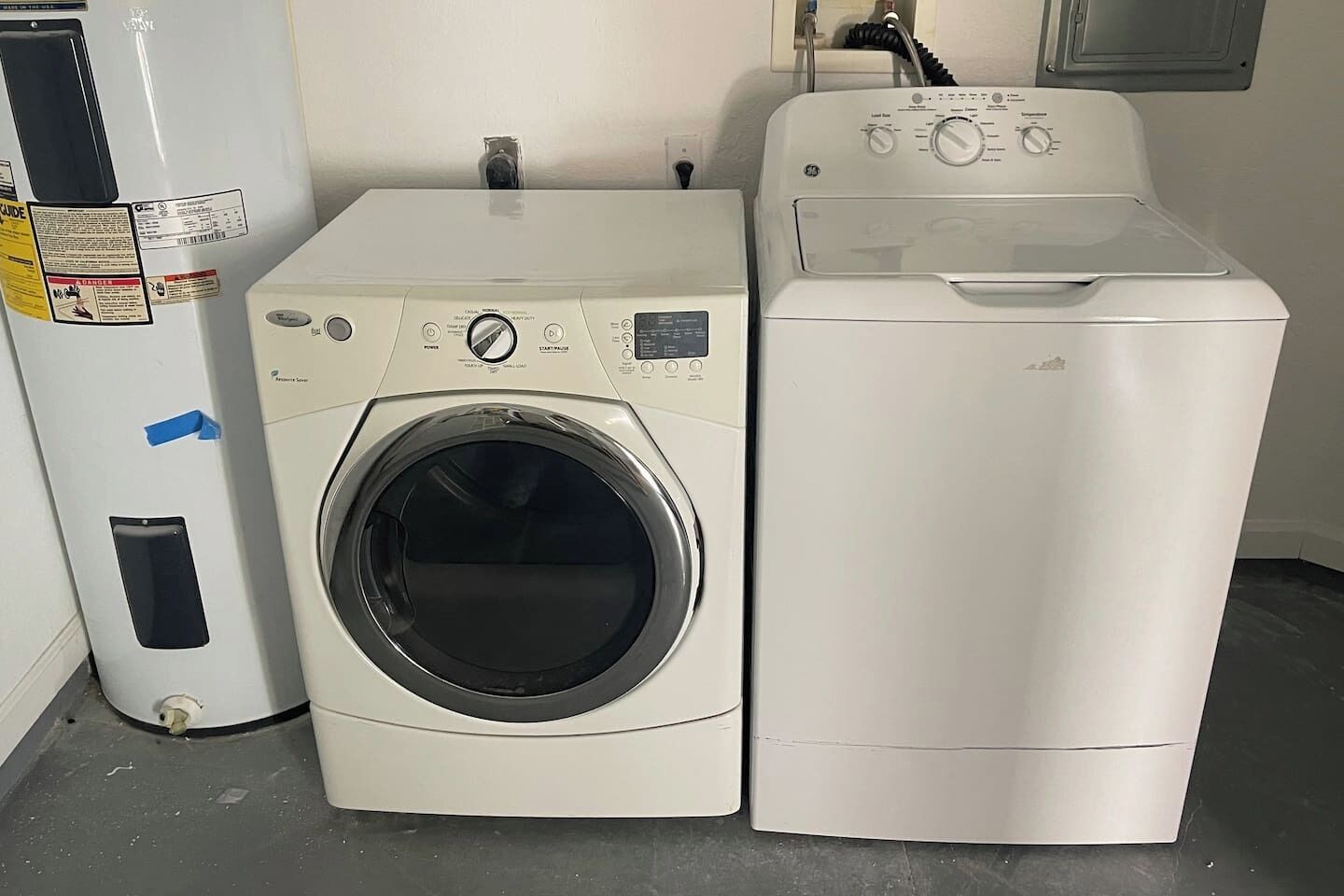 A front-loading washer and dryer side by side in a laundry room.