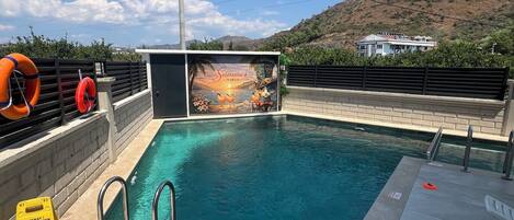 Seasonal outdoor pool, pool umbrellas, sun loungers