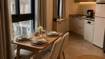 Comfort Condo, Balcony | Private kitchen | Full-sized fridge, stovetop, dishwasher, coffee/tea maker