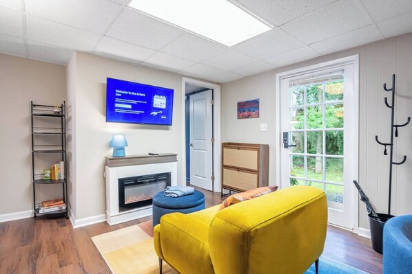 TV, fireplace, books