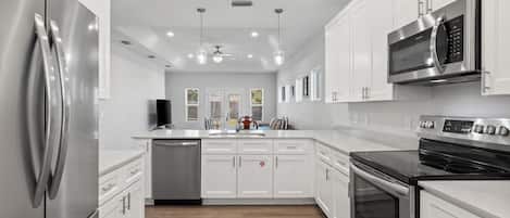 Coffee/tea maker, fridge, microwave, oven