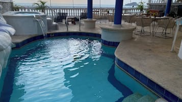 Outdoor pool, open 8:30 AM to 10:30 PM, pool loungers