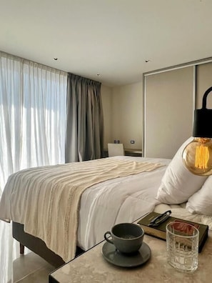 Deluxe Suite, City View | In-room safe, desk, laptop workspace, blackout drapes