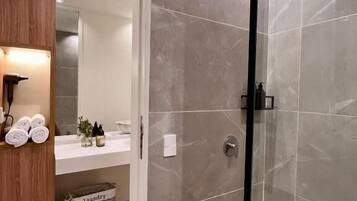 Deluxe Suite, City View | Bathroom | Shower, hair dryer, towels, soap