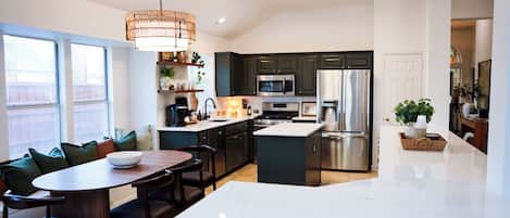 Coffee/tea maker, fridge, microwave, oven