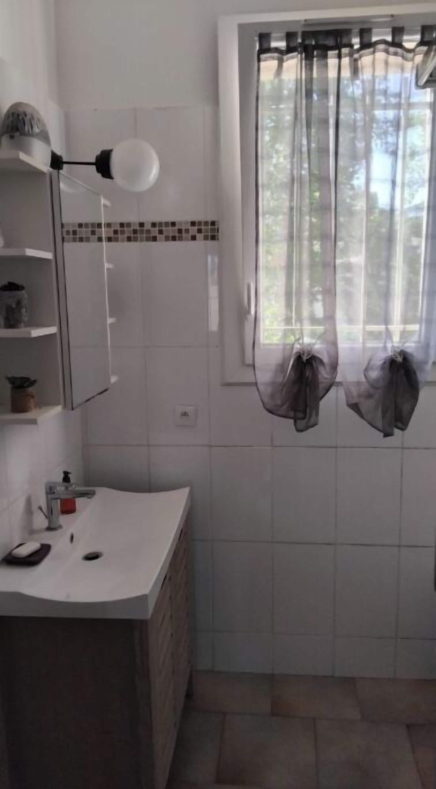 Shower, hair dryer, towels, toilet paper