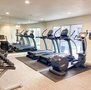 A gym with treadmills, ellipticals, and weight machines. - 1 B/1 BA fully furnished unit in luxury apartment community/ Indianapolis/ 46260 (Indianapolis)
