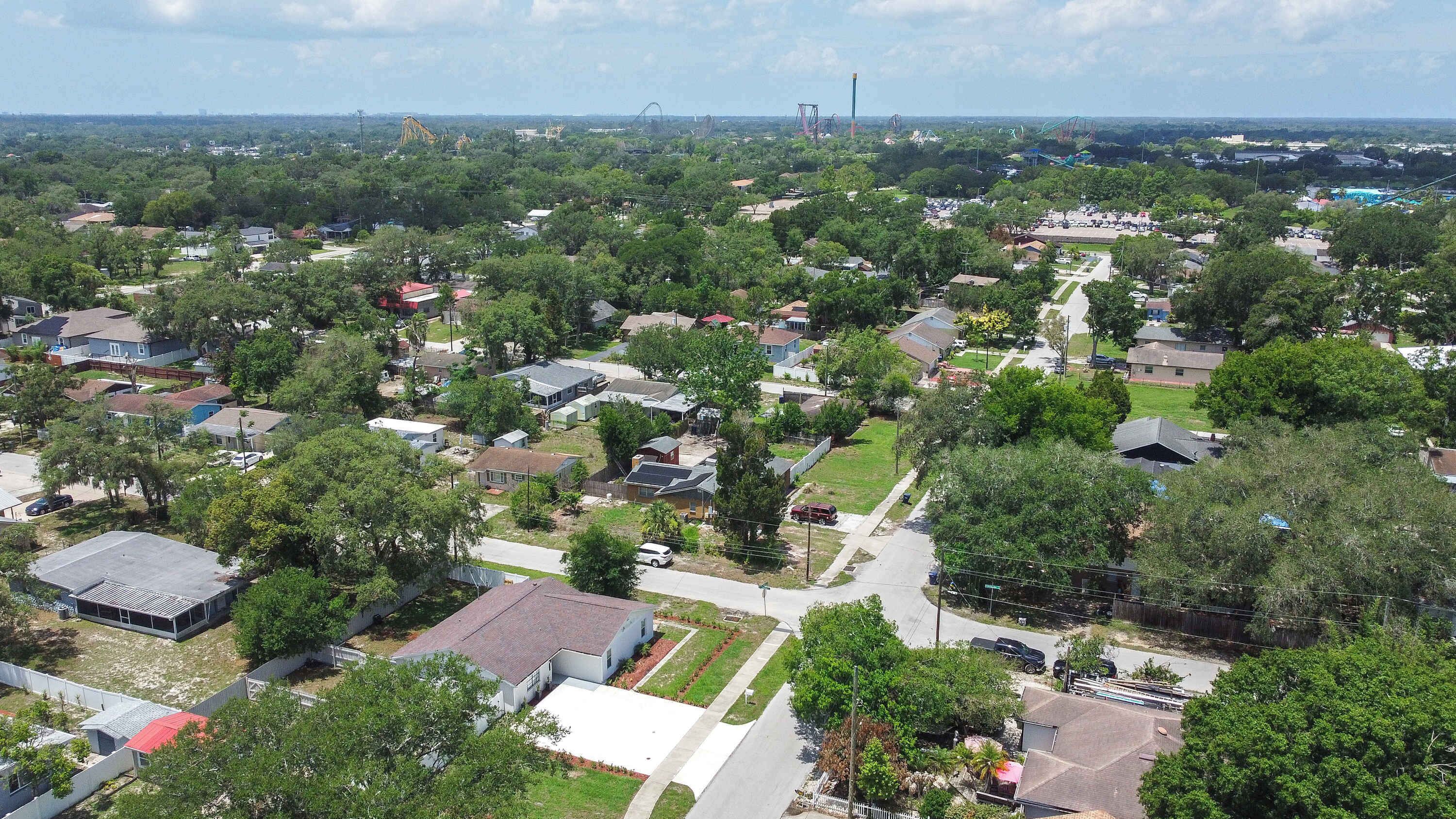 A residential area with houses, streets, and a distant amusement park.