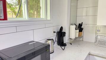 Coffee/tea maker, fridge, microwave, oven