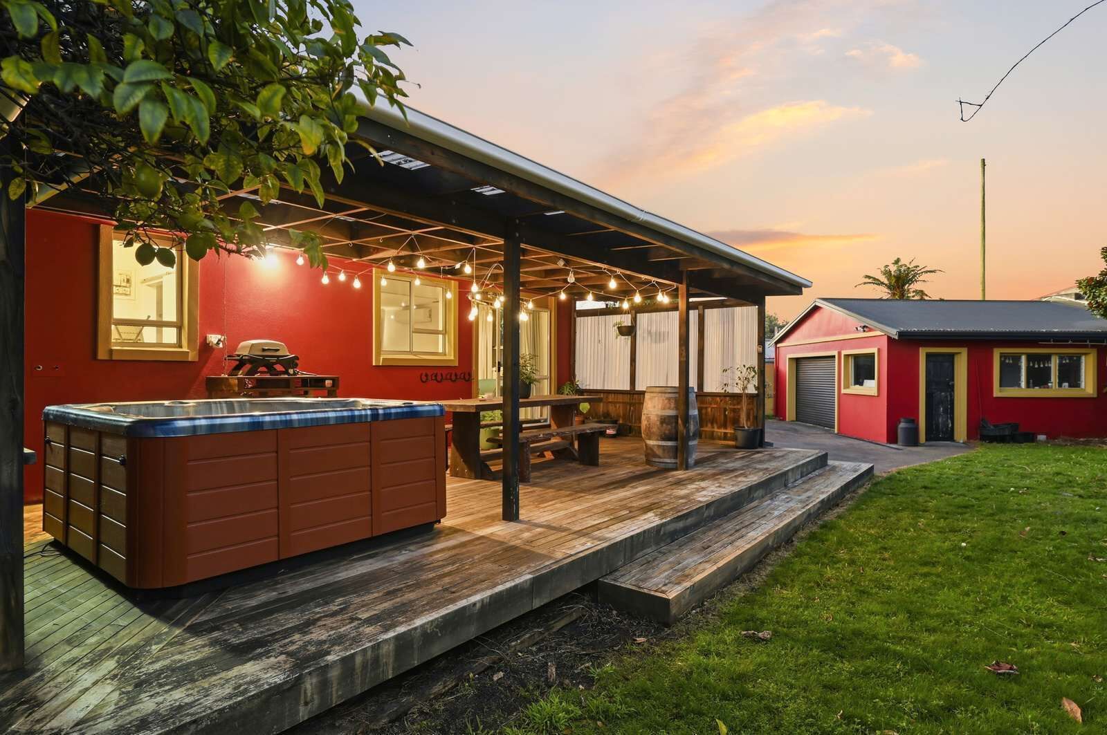 Rear deck and garage at sunset