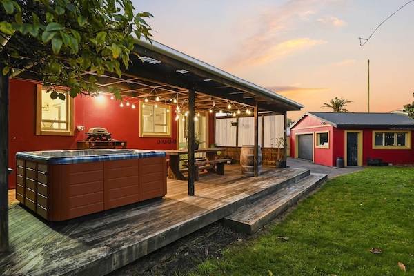 Rear deck and garage at sunset