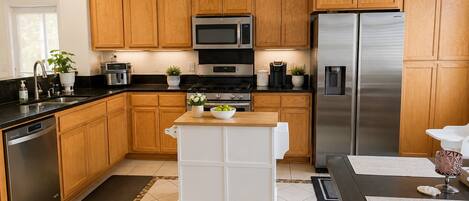Fridge, microwave, coffee/tea maker, cookware/dishes/utensils