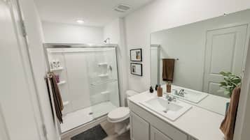 Shower, towels, soap, toilet paper