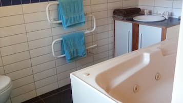 Jetted bath, hair dryer, towels, soap