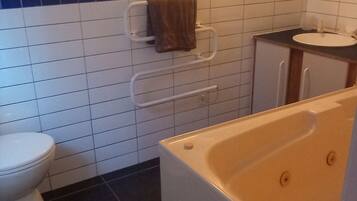 Jetted bath, hair dryer, towels, soap
